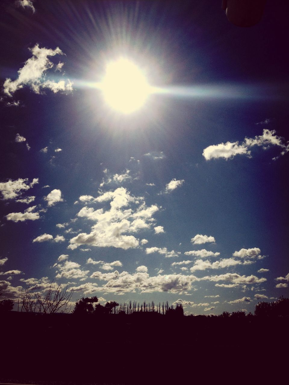 sun, sunbeam, silhouette, sunlight, sky, tranquility, beauty in nature, tranquil scene, scenics, lens flare, nature, low angle view, cloud - sky, landscape, bright, sunny, idyllic, outdoors, tree, no people