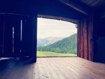 Scenic view of mountains seen through window