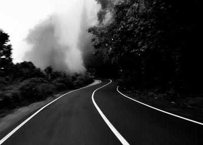 Empty road passing through landscape