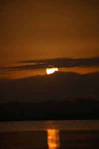 Scenic view of sea against romantic sky at sunset