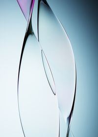Close-up of reflection against clear blue sky