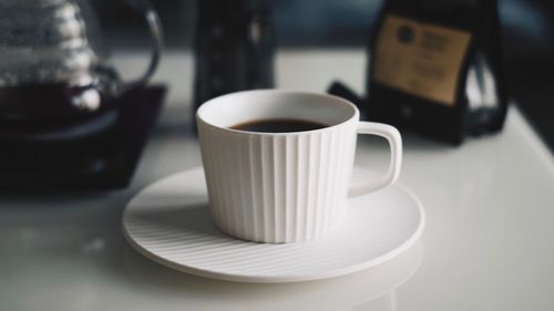 Close-up of coffee cup on table