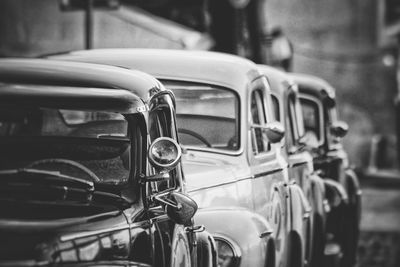 Close-up of vintage cars parked in city