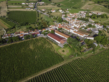 High angle view of agricultural field by houses