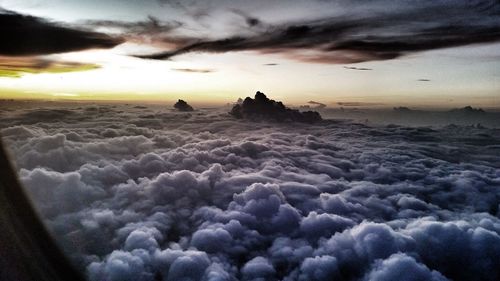 Scenic view of landscape against cloudy sky