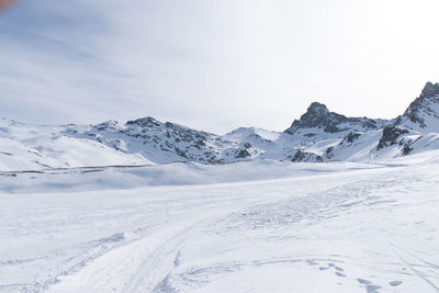 Scenic view of snowcapped mountains against sky