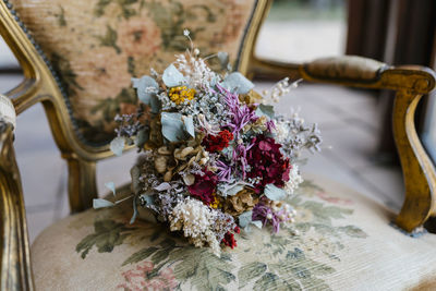 Bunch of flowers on chair at banquet