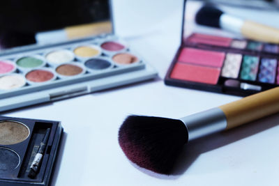 Close-up of make-up on table