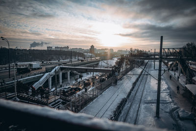 High angle view of railroad tracks against sky during sunset