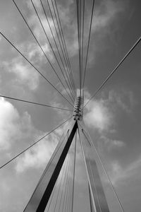 Low angle view of bridge against cloudy sky