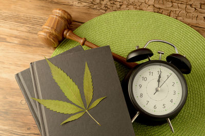 High angle view of clock on table