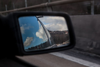 Reflection of car on side-view mirror