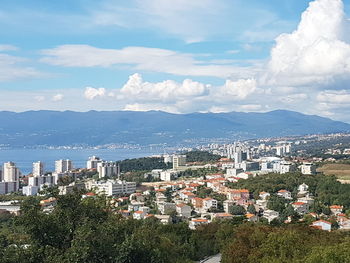 High angle view of buildings in city against sky