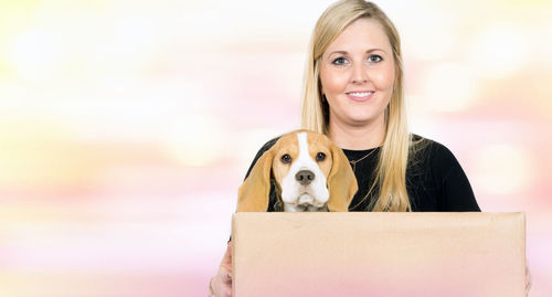 Portrait of smiling woman with dog