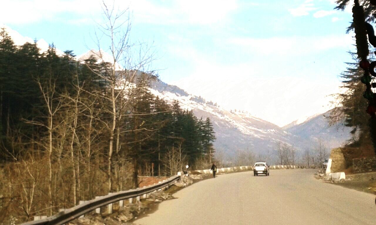 the way forward, transportation, road, mountain, snow, winter, tree, cold temperature, sky, diminishing perspective, tranquil scene, country road, beauty in nature, vanishing point, nature, scenics, tranquility, mountain range, car, land vehicle