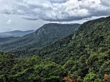 Scenic view of mountains against cloudy sky