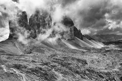 Rocky mountains against clouds