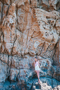 Woman standing on rock