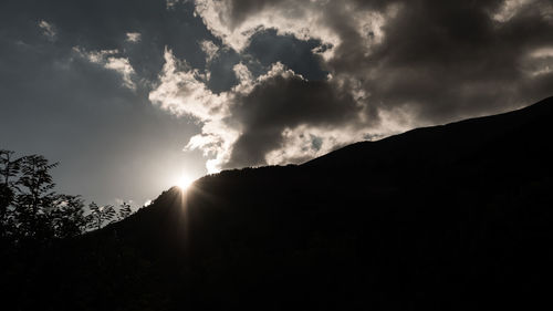 Low angle view of silhouette mountain against sky