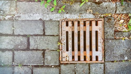 View of manhole on metal grate