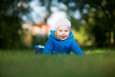 Cute boy smiling in grass