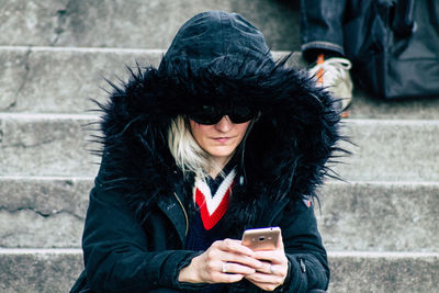 Young woman using mobile phone