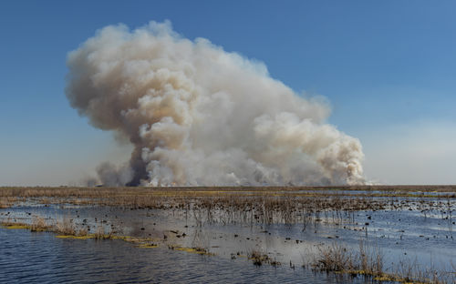 Smoke rises from a controlled burn to minimize future uncontrolled wildfire risk