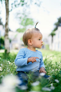 Cute baby girl on field