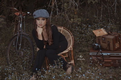 Portrait of woman sitting in forest