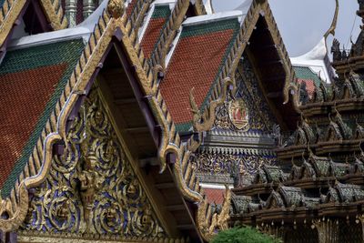 Low angle view of statues on building roof