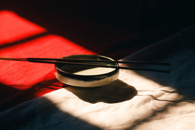 Light and shadows cast on a ceramic incense holder