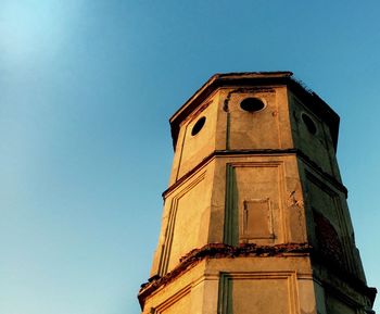 Low angle view of building against clear blue sky