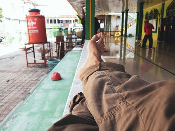 Low section of man relaxing outdoors