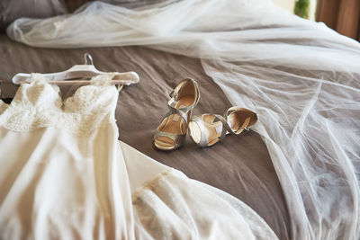 High angle view of shoes on bed