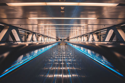 Illuminated escalator in subway