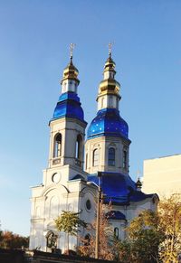 Low angle view of building against blue sky