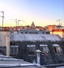 View of city lit up at sunset