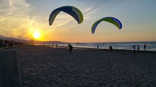 Scenic view of beach against sky during sunset