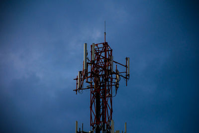 Low angle view of communications tower against sky