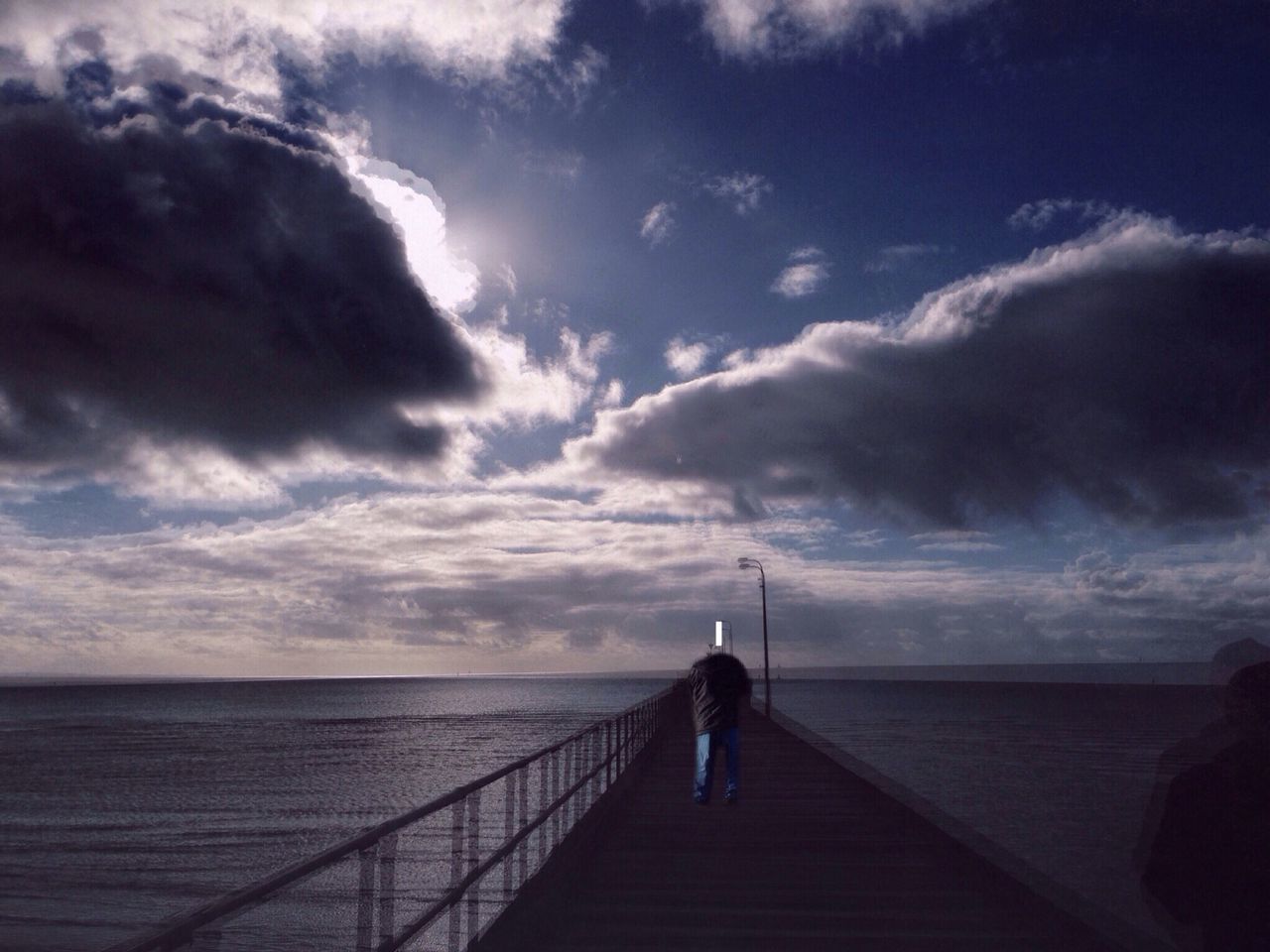 sky, sea, water, cloud - sky, pier, horizon over water, railing, cloudy, the way forward, scenics, tranquility, cloud, tranquil scene, nature, rear view, men, beauty in nature, full length