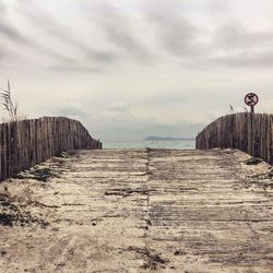 Scenic view of landscape against cloudy sky