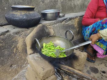 Midsection of woman preparing food