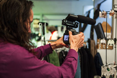 Midsection of woman photographing