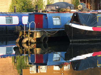 Boats moored in city