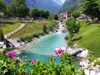 Scenic view of river by mountain