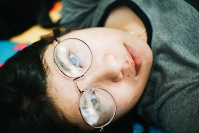 Close-up portrait of woman wearing eyeglasses