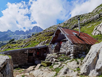 Panoramic view of houses and mountains against sky