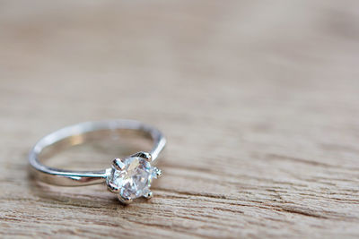 Close-up of wedding rings on table
