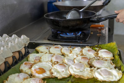 Close-up of meat cooking on barbecue grill