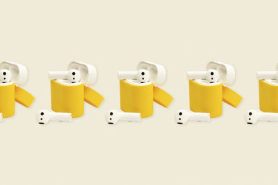 High angle view of colorful containers against white background